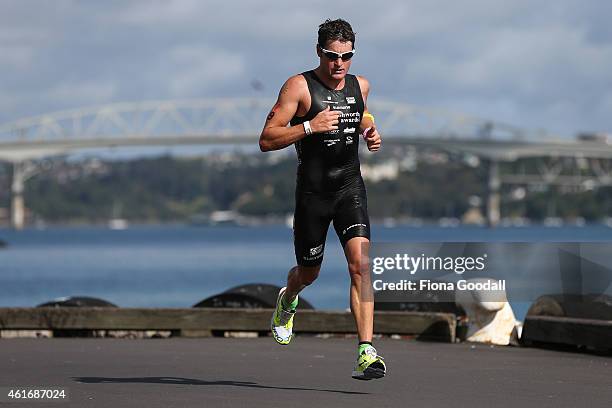 Second placed Leon Griffin of Australia runs along Princes Wharf during Ironman 70.0 on January 18, 2015 in Auckland, New Zealand.