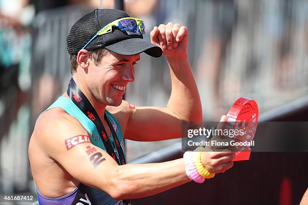 Elite Men's winner Tim Reed of Australia with his trophy at Ironman 70.0 on January 18, 2015 in Auckland, New Zealand.