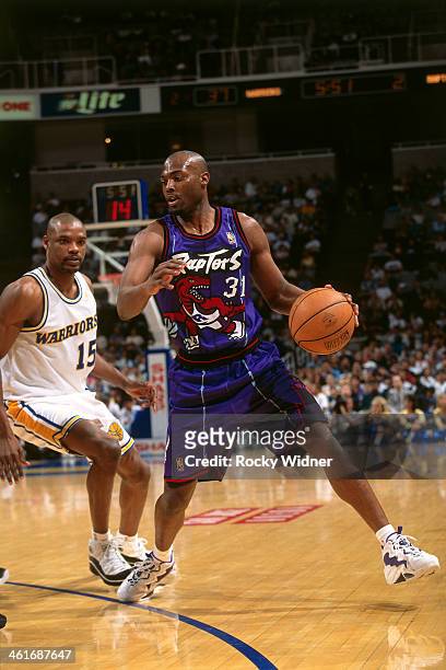 Shawn Respert of the Toronto Raptors dribbles the ball against the Golden State Warriors during a game played on March 15, 1997 at the San Jose Arena...