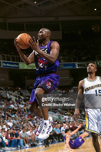 Shawn Respert of the Toronto Raptors shoots the ball against the Golden State Warriors during a game played on March 15, 1997 at the San Jose Arena...