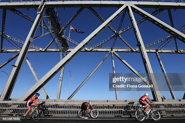 Cyclists breaks down as others head over Auckland Harbour Bridge during Ironman 70.0 on January 18, 2015 in Auckland, New Zealand.