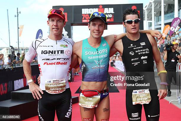 Elite Men's top three Leon Griffin in second, Tim Reed in first place, both of Australia and Cameron Brown of New Zealand in third at Ironman 70.0 on...