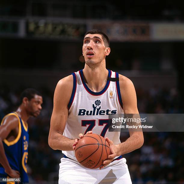 Gheorghe Muresan of the Washington Bullets shoots a foul shot against the Golden State Warriors during a game played on December 15, 1996 at the San...