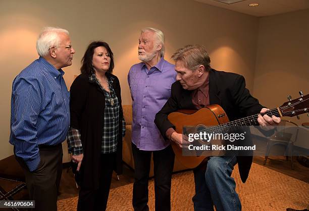 Musicians Mike Settle, Mary Arnold Miller, Kenny Rogers, and Terry Williams perform backstage during a panel discussion with Kenny Rogers and the...