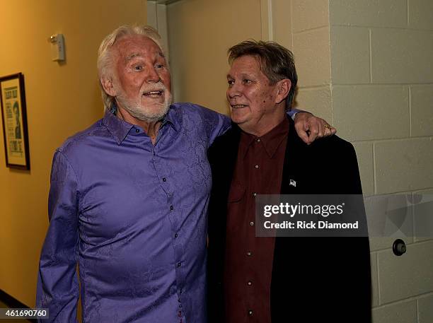 Musicians Kenny Rogers and Terry Williams attend a panel discussion with Kenny Rogers and the First Edition at the Country Music Hall Of Fame and...
