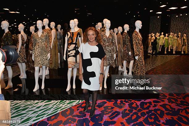 Designer Diane von Furstenberg poses for photographers in front of her collection of Wrap Dresses during the Journey of A Dress Exhibition at LACMA...