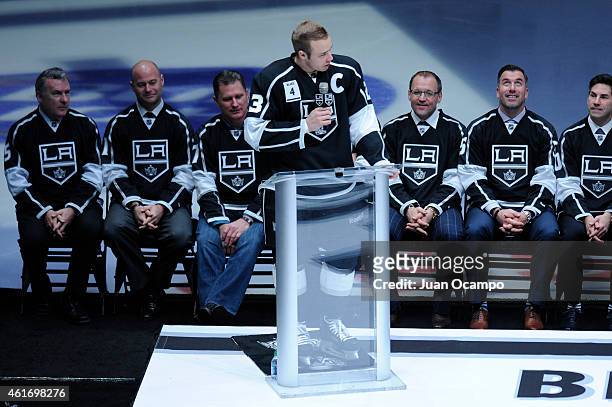 Dustin Brown of the Los Angeles Kings speaks during Rob Blake's jersey retirement ceremony before a game between the Los Angeles Kings and the...