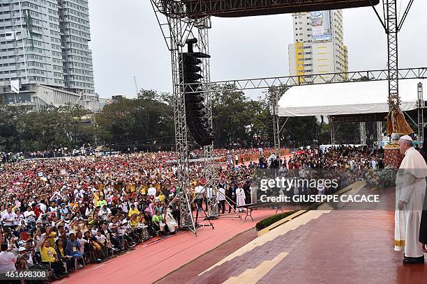 Pope Francis looks out to the crowd during his visit to the University of Santo Tomas in Manila on January 18, 2015. Pope Francis will celebrate mass...