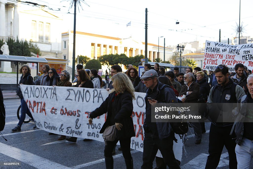 Greek people march in the protest for more refugee rights...