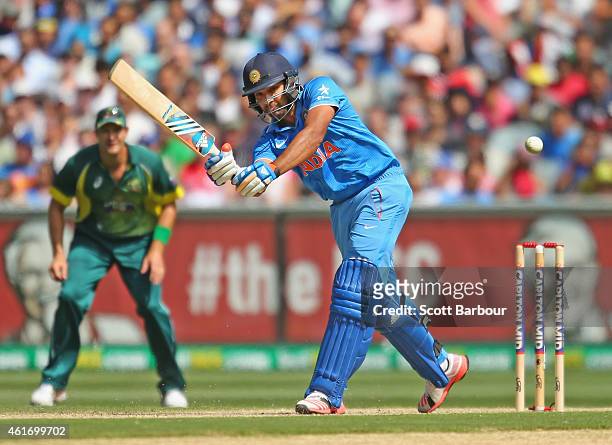 Rohit Sharma of India hits a boundary during the One Day International match between Australia and India at the Melbourne Cricket Ground on January...