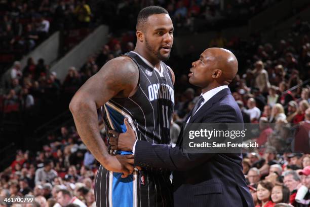 Glen Davis hugs Jacque Vaughn of the Orlando Magic during the game against the Portland Trail Blazers on January 8, 2014 at the Moda Center Arena in...