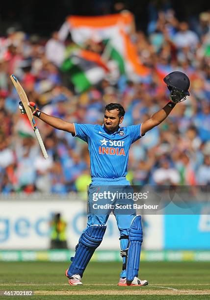 Rohit Sharma of India celebrates as he reaches his century during the One Day International match between Australia and India at the Melbourne...