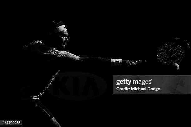 Roger Federer of Switzerland hits a backhand during a practice session ahead of the 2015 Australian Open at Melbourne Park on January 18, 2015 in...