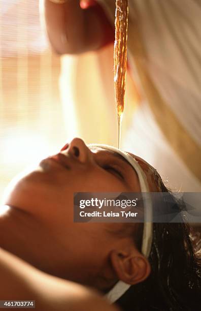 Shirodhara - an ayurvedic application where warm medicated oil is poured over the head in a rhythmic stream, used to alleviate insomnia, skin...