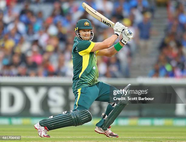 Shane Watson of Australia hits a boundary during the One Day International match between Australia and India at the Melbourne Cricket Ground on...