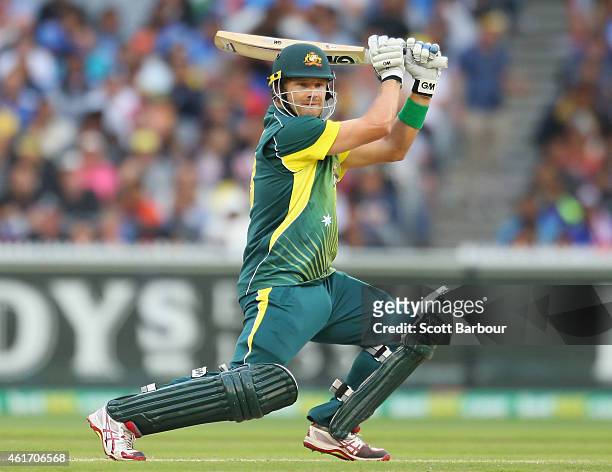 Shane Watson of Australia hits a boundary during the One Day International match between Australia and India at the Melbourne Cricket Ground on...