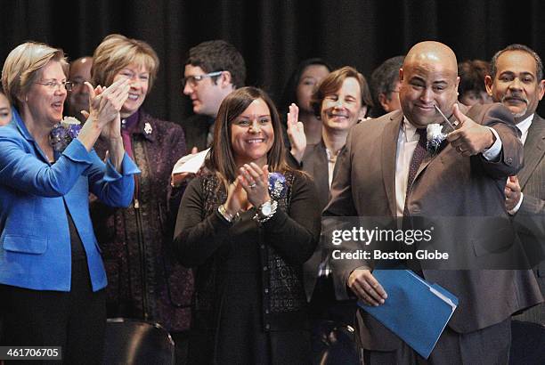 Daniel Rivera, right, acknowledged a standing ovation before his swearing-in as mayor of Lawrence, Saturday, Jan. 4, 2014. On hand were U.S. Sen....