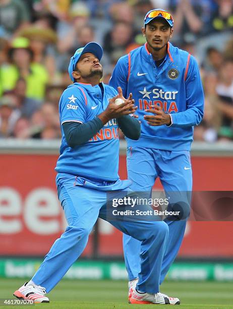 Suresh Raina of India takes a catch to dismiss David Warner of Australia during the One Day International match between Australia and India at the...