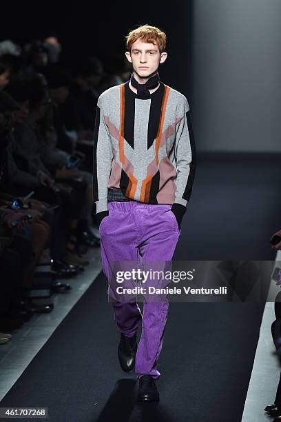 Model walks the runway during the Bottega Veneta show as a part of Milan Menswear Fashion Week Fall Winter 2015/2016 on January 18, 2015 in Milan,...