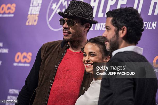French actors Didier Morville aka Joeystarr, Alice Belaidi and Manu Payet, pose on January 17, 2015 during the 18th Comedy film festival in L'Alpe...