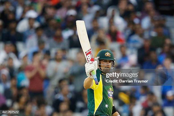 Aaron Finch of Australia raises his bat after scoring 50 runs during the One Day International match between Australia and India at Melbourne Cricket...