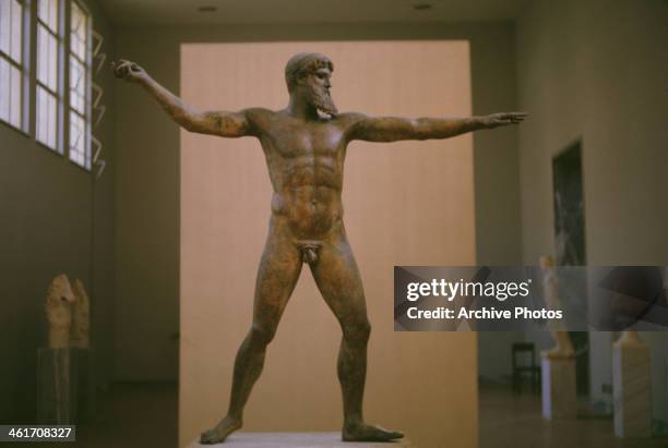 Bronze sculpture of the god Zeus, or possibly Poseidon, in the National Archaeological Museum in Athens, Greece, circa 1960. Dating back to the 5th...