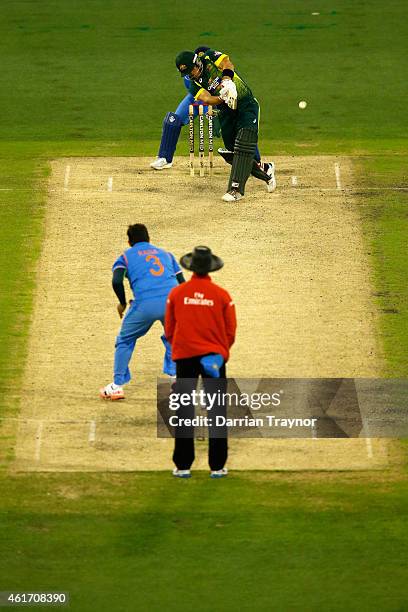 Aaron Finch of Australia hits a ball for 6 runs during the One Day International match between Australia and India at Melbourne Cricket Ground on...