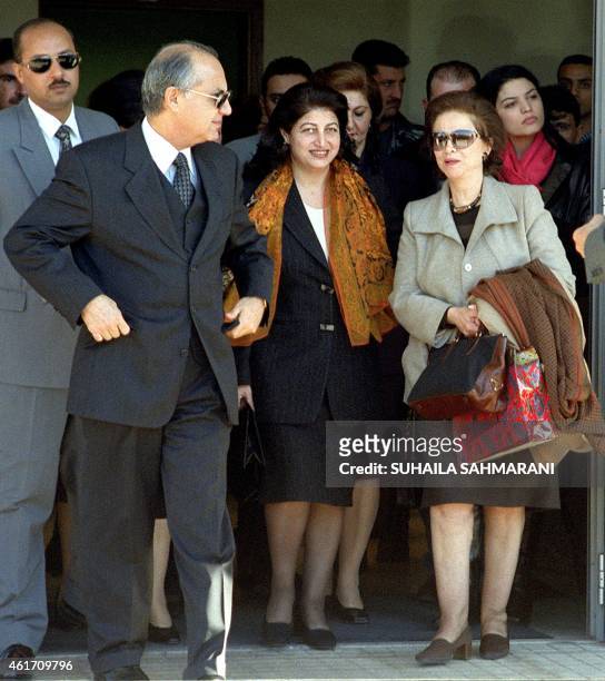 Egyptian actress Faten Hamama walks out of Beirut International Airport accompanied by Lebanese deputy Bahia al-Hariri and the Egyptian ambassador...