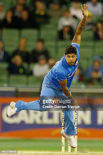 Umesh Yadav of India bowls during the One Day International match between Australia and India at Melbourne Cricket Ground on January 18, 2015 in...