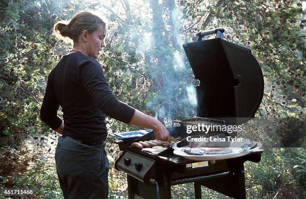 Guide on the Maria Island Walk cooks a barbeque for guests on their second night's stay. The latest trend on the Tasmanian travel scene, luxury bush...