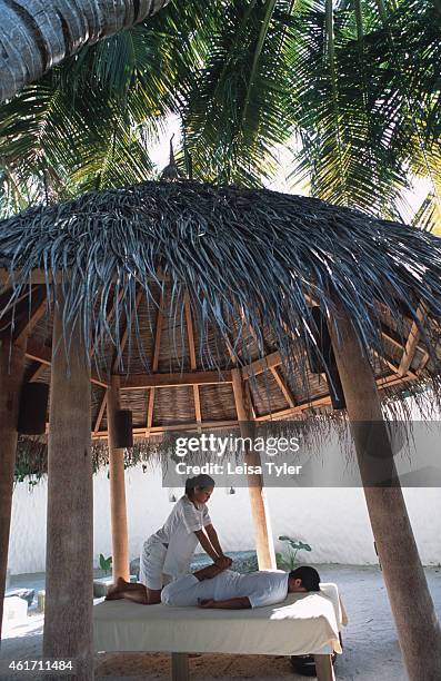 Traditional Thai massage at the Six Senses Spa at Soneva Fushi, a luxury resort in Baa Atoll, the Maldives. Upmarket, Soneva Fushi is one of many...