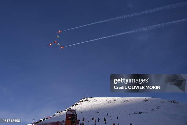 Fighter jets of the "Patrouille Suisse" fly during the Lauberhorn ski races on January 18, 2015 above Wengen, Berner Alps. AFP PHOTO / OLIVIER MORIN