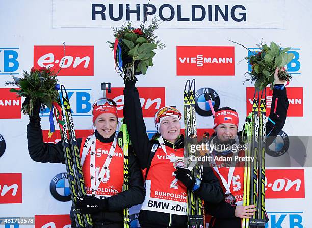 Franziska Preuss of Germany second place, Darya Domracheva of Belarus first place, and Veroknika Vitkova of the Czech Republic third place celebrate...