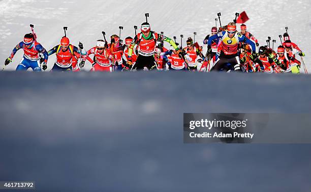 Darya Domracheva of Belarus and Kaisa Makarainen of Finland lead the pack during the IBU Biathlon World Cup Women's Mass Start on January 18, 2015 in...