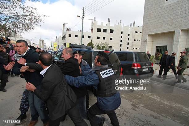 Policemen disperse protesters outside the Foreign Affairs ministry after Palestinian youths hurled eggs at the motorcade of Canadian Foreign Minister...