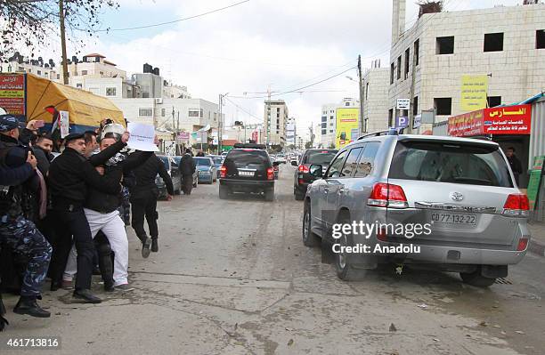 Policemen disperse protesters outside the Foreign Affairs ministry after Palestinian youths hurled eggs at the motorcade of Canadian Foreign Minister...