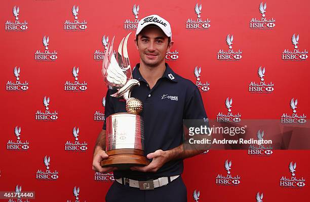 Gary Stal of France poses with the trophy after winning the Abu Dhabi HSBC Golf Championship at the Abu Dhabi Golf Cub on January 18, 2015 in Abu...