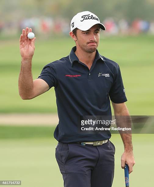 Gary Stal of France waves to the crowd on the 18th green after winning the Abu Dhabi HSBC Golf Championship at the Abu Dhabi Golf Cub on January 18,...