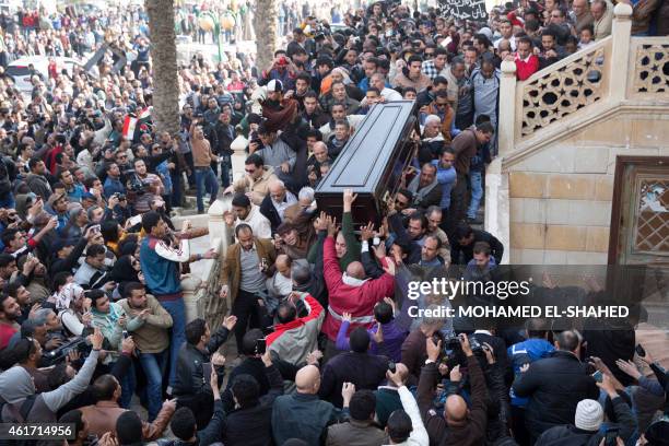 Mourners carry the coffin of Egyptian actress Faten Hamama during her funeral on January 18, 2015 in 6th of October City on the outskirts of Cairo....