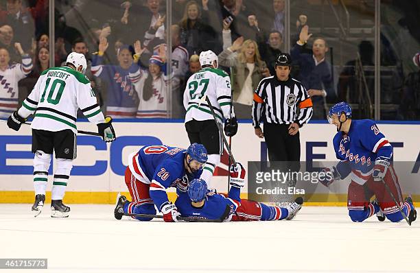 Rick Nash of the New York Rangers celebrates his game winning goal with teammates Chris Kreider and Derek Stepan in the third period as Shawn Horcoff...