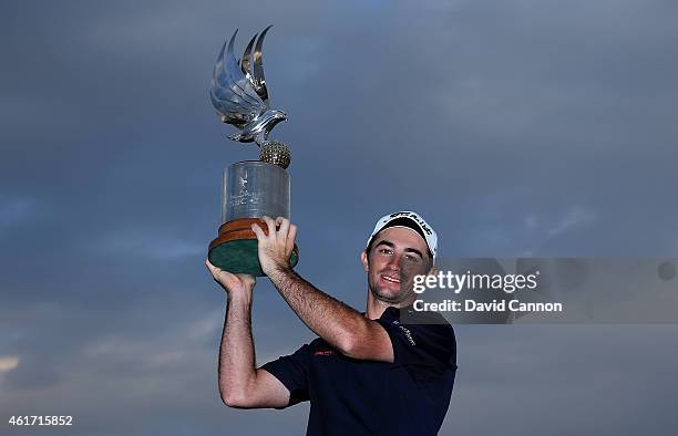 Gary Stal of France proudly holds the trophy after his win in the Abu Dhabi HSBC Golf Championship at Abu Dhabi Golf Club on January 18, 2015 in Abu...