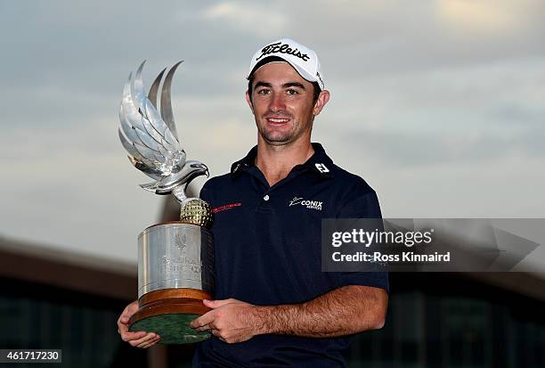 Gary Stal of France celebrates with the winners trophy after the final round of the Abu Dhabi HSBC Golf Championship at the Abu Dhabi Golf Club on...