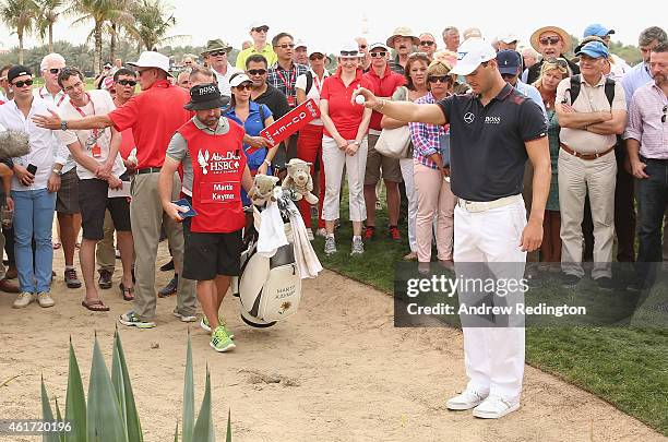 Martin Kaymer of Germany takes a drop on the ninth hole during the final round of the Abu Dhabi HSBC Golf Championship at the Abu Dhabi Golf Cub on...