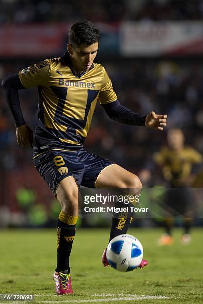 Efrain Velarde drives the ball during a match between Queretaro and Pumas UNAM as part of the Clausura 2014 Liga MX at Corregidora Stadium on January...