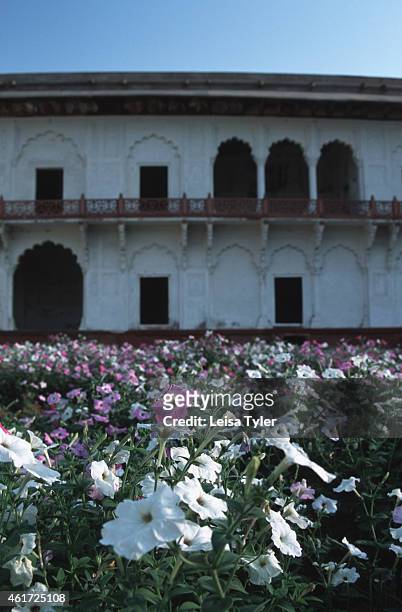 Flower gardens inside the Red Fort in Agra. An eclectic fusion of architectural styles and eras, the construction of the Red Fort began in the 10th...