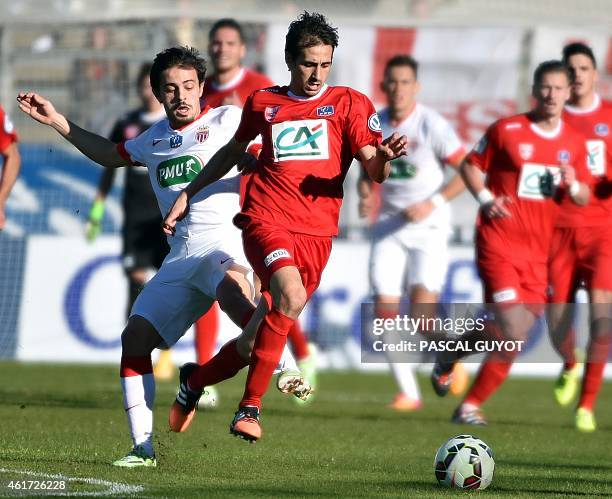 Nimes' Algerian defender Fethi Harek vies with Monaco's Bernardo during the French Cup football match Nimes vs Monaco, at the Costieres Stadium in...