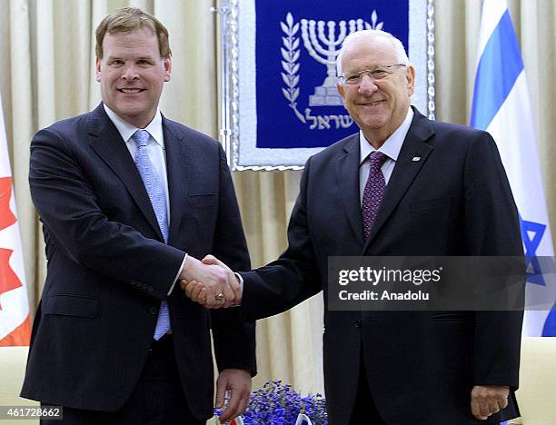 Israeli President Reuven Rivlin shakes hand with Canadian Foreign Minister John Baird during a meeting at the presidential palace in Jerusalem,...