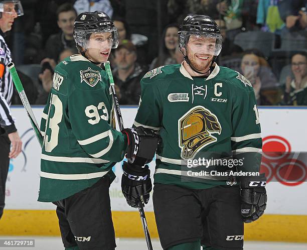 Mitchell Marner qnd Max Domi of the London Knights seem pleased with the play against the Sarnia Sting in an OHL game at Budweiser Gardens on January...