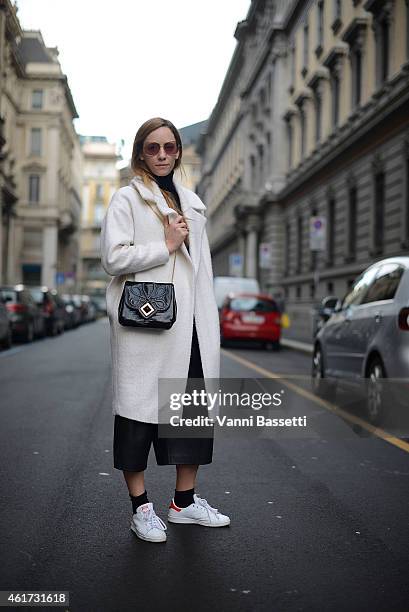 Federica Cingolani poses wearing an Asos coat, COS pants, Adidas shoes and Roger Vivier bag during day 2 of Milan Menswear Fashion Week Fall/Winter...