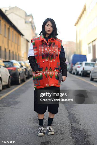 Noey Park poses wearing an El Charro top, Marni shirt and Converse shoes during day 2 of Milan Menswear Fashion Week Fall/Winter 2015/2016 on January...